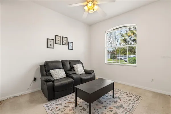a living room with furniture and a window