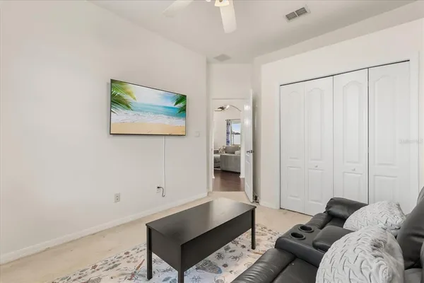 a living room with furniture and a rug