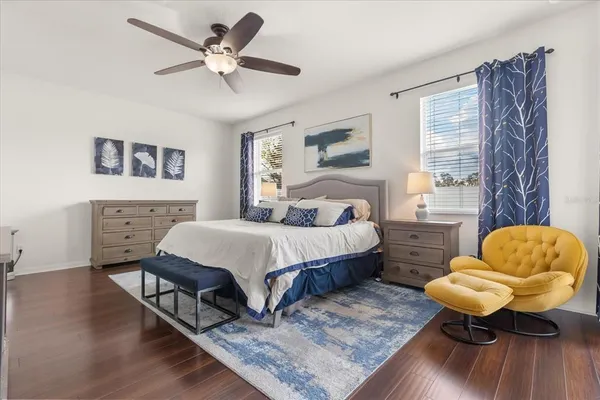 a bedroom with a bed window and couch