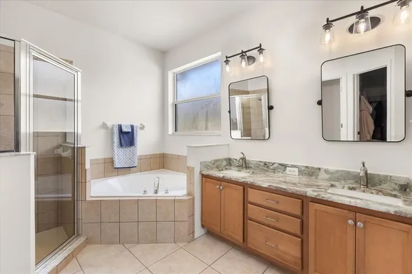 a bathroom with a granite countertop sink mirror and