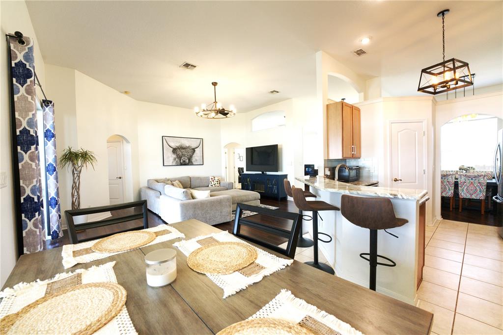 2309 Wolf Ridge Lane Mount Dora, FL 32757 - Photo 25 of 62 a living room with furniture and a chandelier