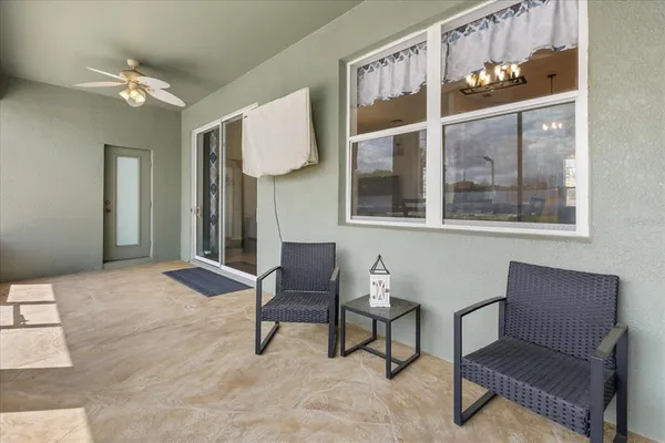 a view of a livingroom with furniture and windows