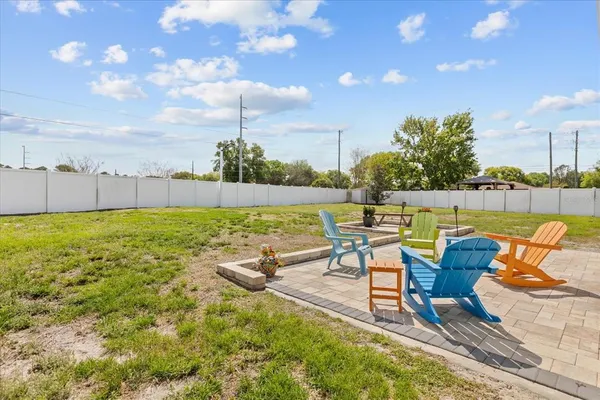 a view of a swimming pool and lounge chairs