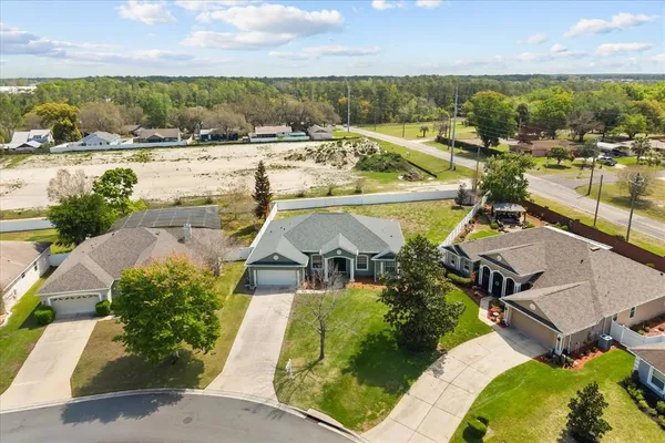 an aerial view of a house with a ocean view