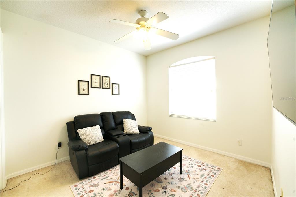2309 Wolf Ridge Lane Mount Dora, FL 32757 - Photo 36 of 62 a living room with furniture and a window