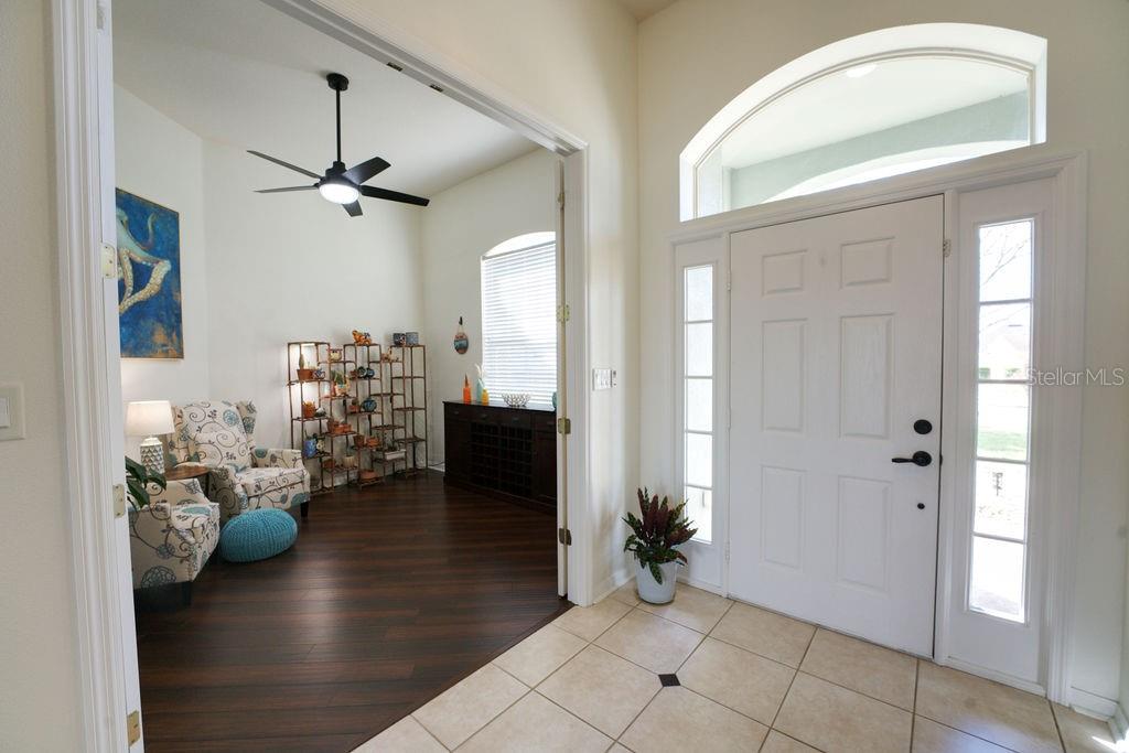 2309 Wolf Ridge Lane Mount Dora, FL 32757 - Photo 4 of 62 a view of a livingroom with furniture and hardwood floor