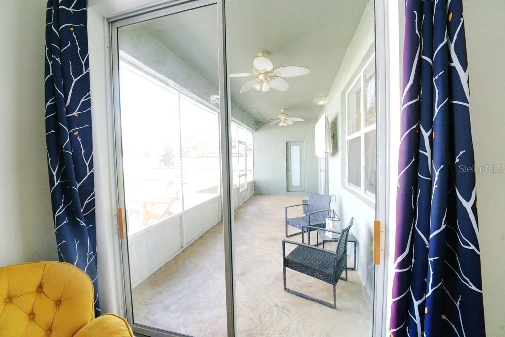 2309 Wolf Ridge Lane Mount Dora, FL 32757 - Photo 46 of 62 a living room with furniture and a large window