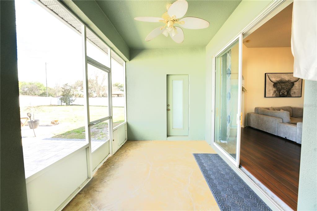 2309 Wolf Ridge Lane Mount Dora, FL 32757 - Photo 47 of 62 a bedroom with a bed and a large window with outer view