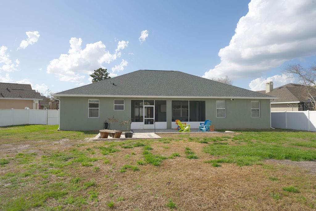 2309 Wolf Ridge Lane Mount Dora, FL 32757 - Photo 51 of 62 a house view with a sitting space and garden