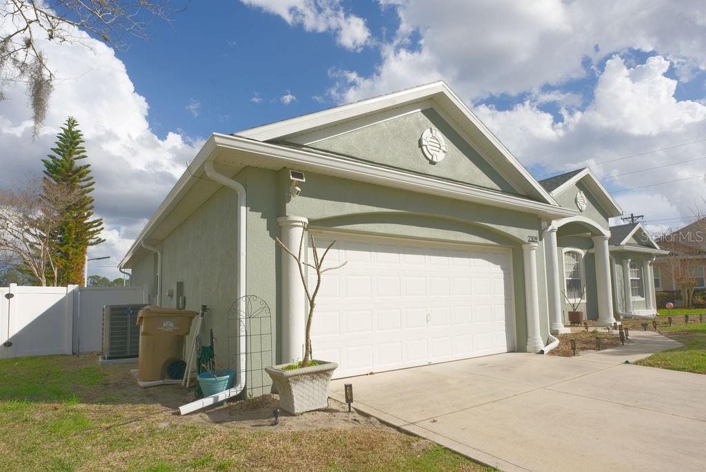 2309 Wolf Ridge Lane Mount Dora, FL 32757 - Photo 59 of 62 a front view of a house with a garage