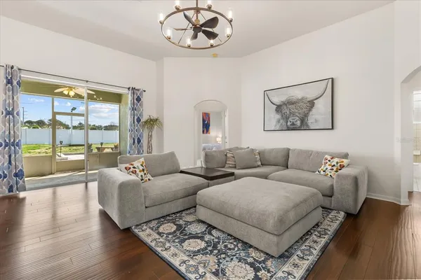 a living room with furniture and a large window