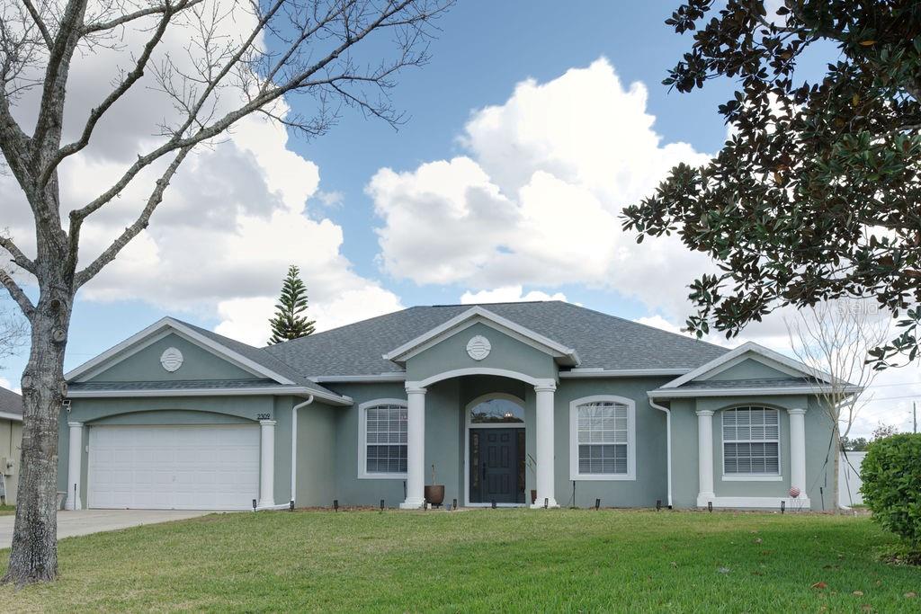 2309 Wolf Ridge Lane Mount Dora, FL 32757 - Photo 61 of 62 front view of a house with a yard