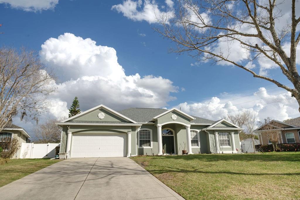 2309 Wolf Ridge Lane Mount Dora, FL 32757 - Photo 62 of 62 a front view of a house with a yard