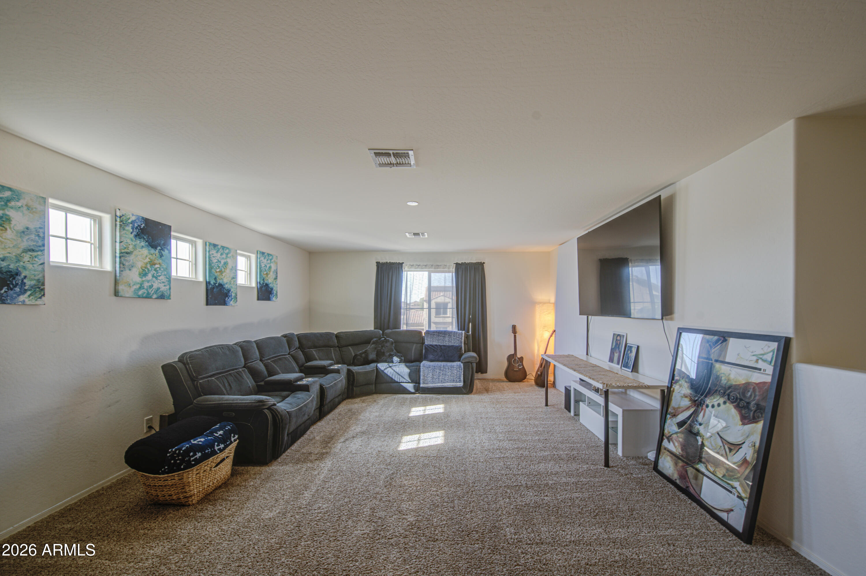 12202 West Del Rio Lane Avondale, AZ 85323 - Photo 20 of 49 a living room with furniture and a potted plant
