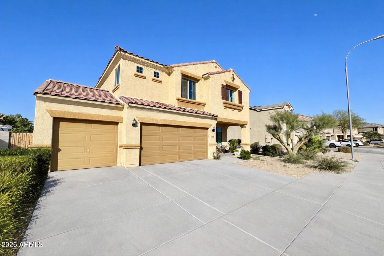 12202 West Del Rio Lane Avondale, AZ 85323 - Photo 2 of 60 a view of a house with a outdoor space