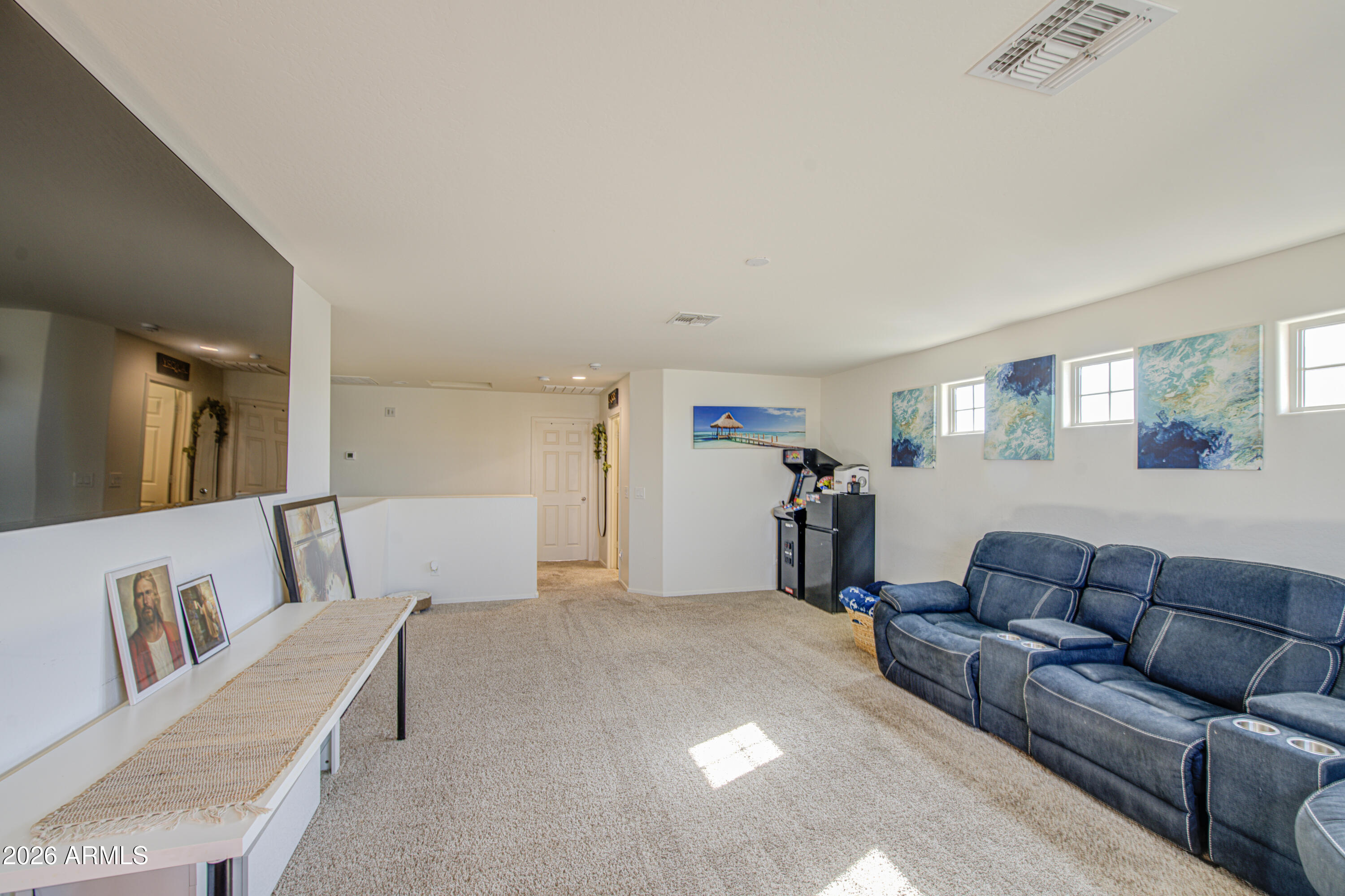 12202 West Del Rio Lane Avondale, AZ 85323 - Photo 22 of 49 a living room with furniture and a couch
