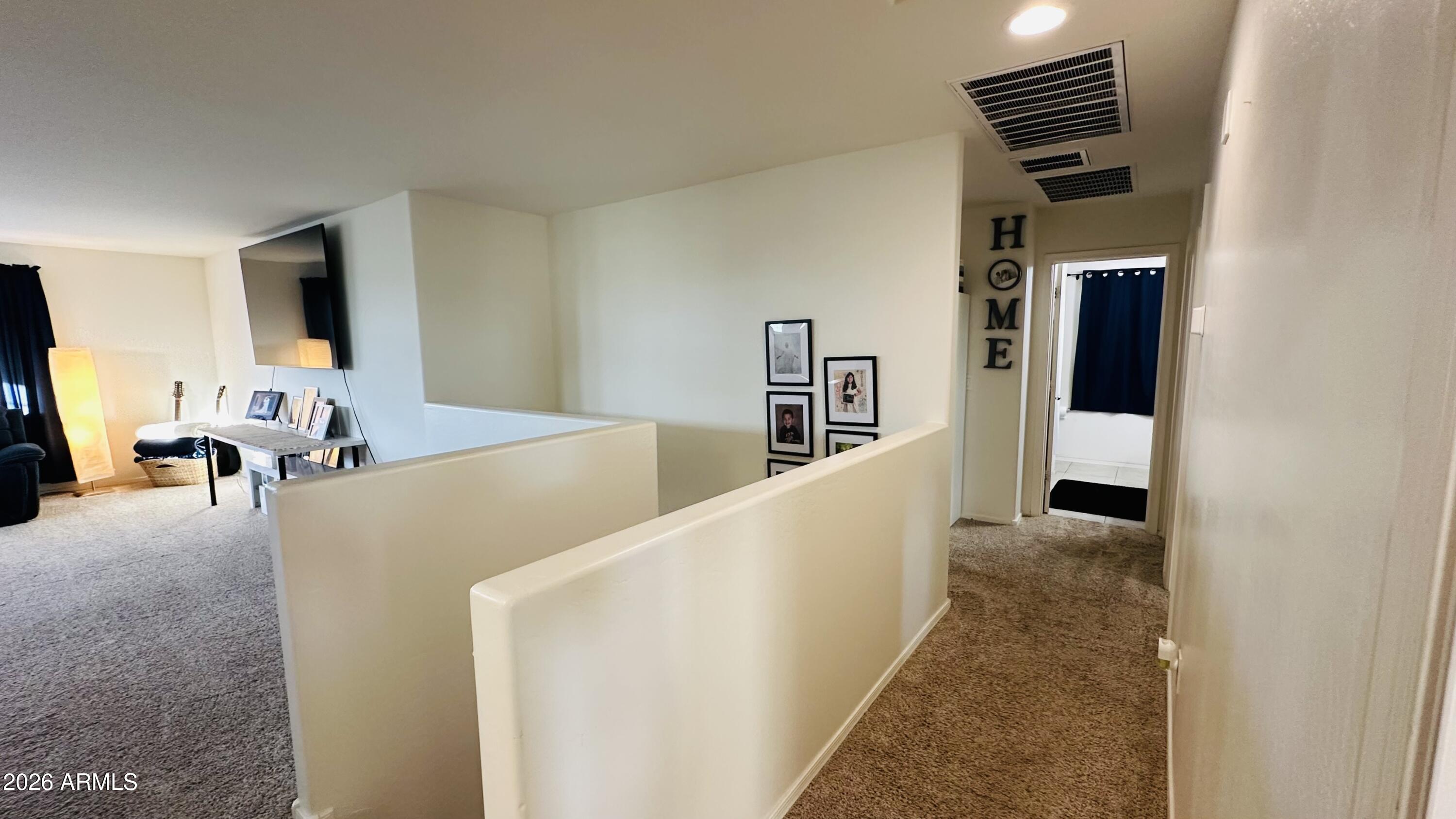 12202 West Del Rio Lane Avondale, AZ 85323 - Photo 33 of 60 a living room with furniture and flat screen tv