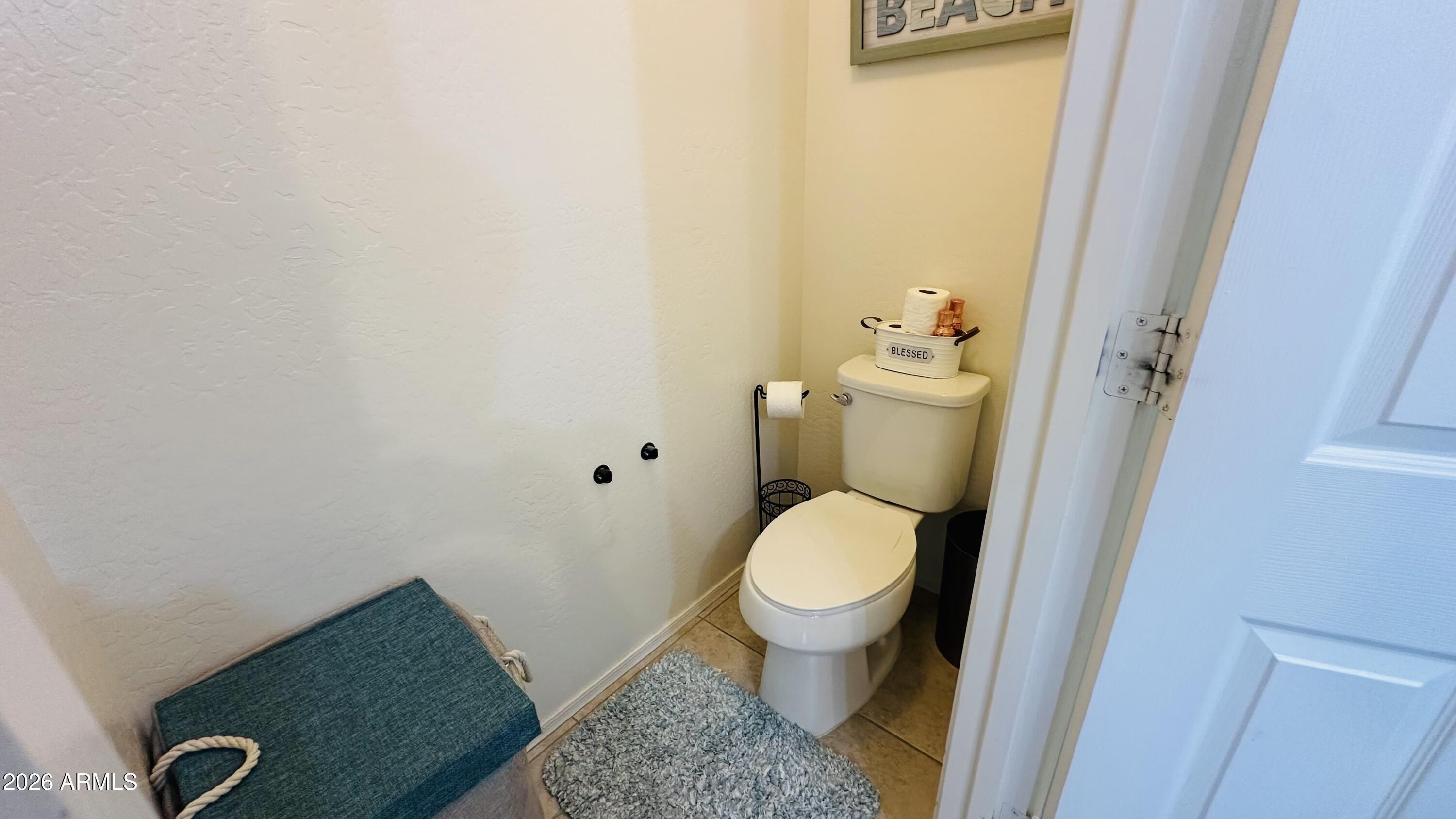 12202 West Del Rio Lane Avondale, AZ 85323 - Photo 38 of 60 a bathroom with a sink and a toilet