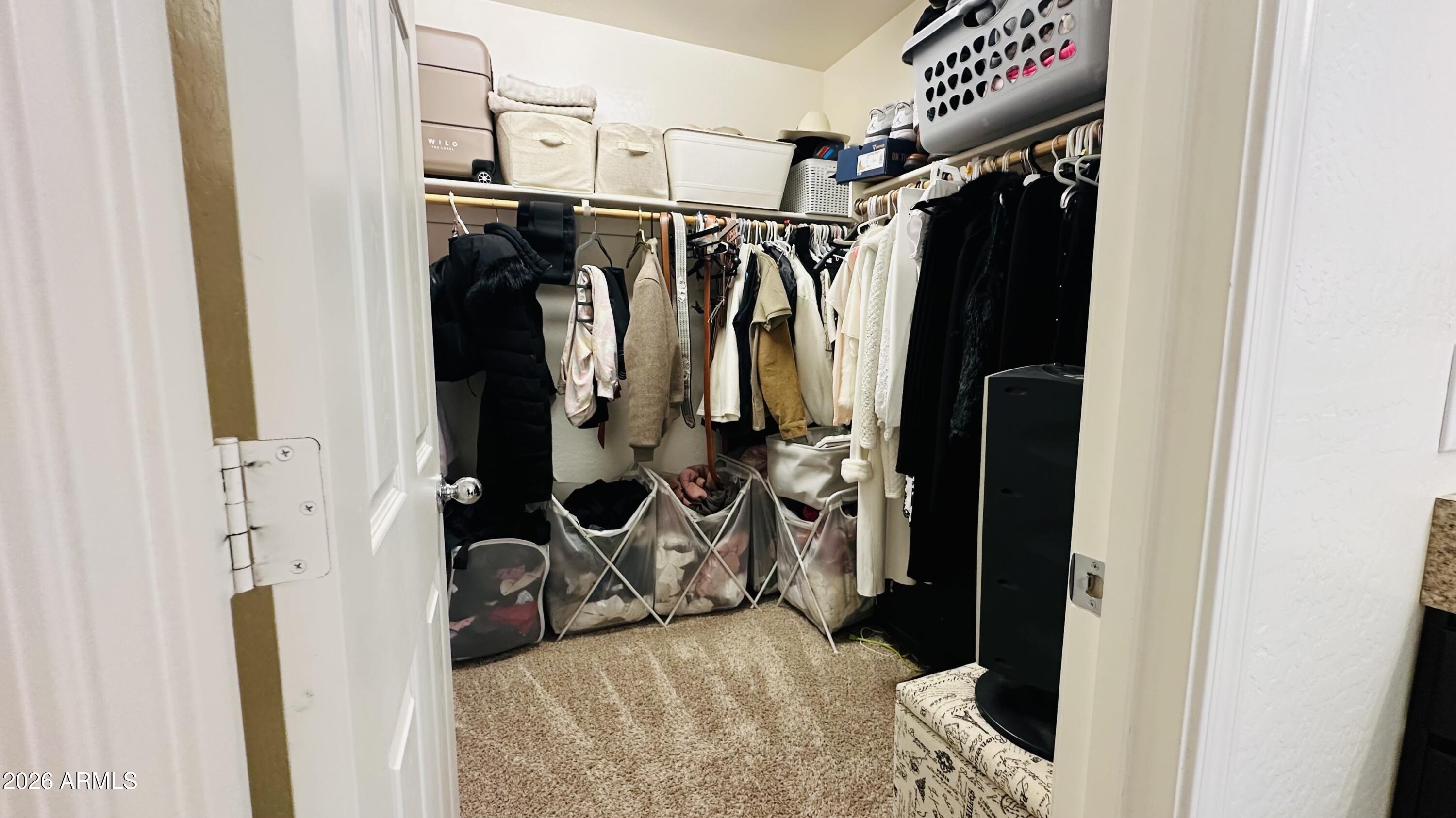 12202 West Del Rio Lane Avondale, AZ 85323 - Photo 40 of 60 a view of walk in closet with clothes