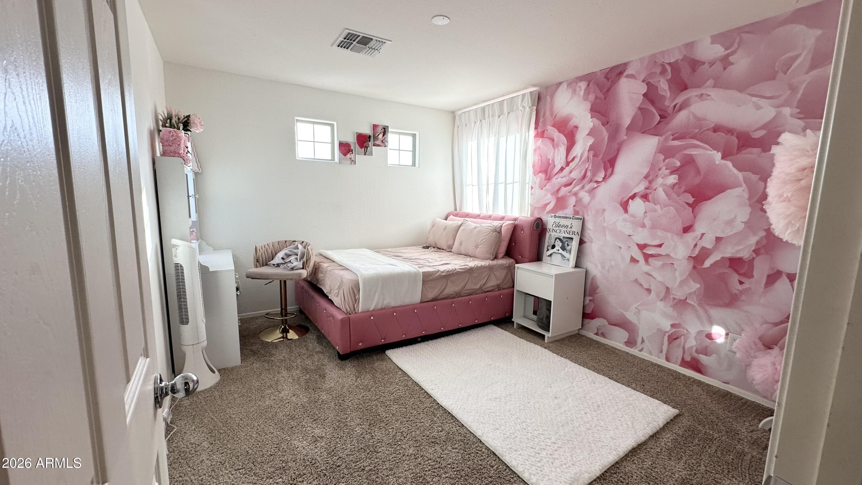 12202 West Del Rio Lane Avondale, AZ 85323 - Photo 48 of 60 a bedroom with a bed dresser and window