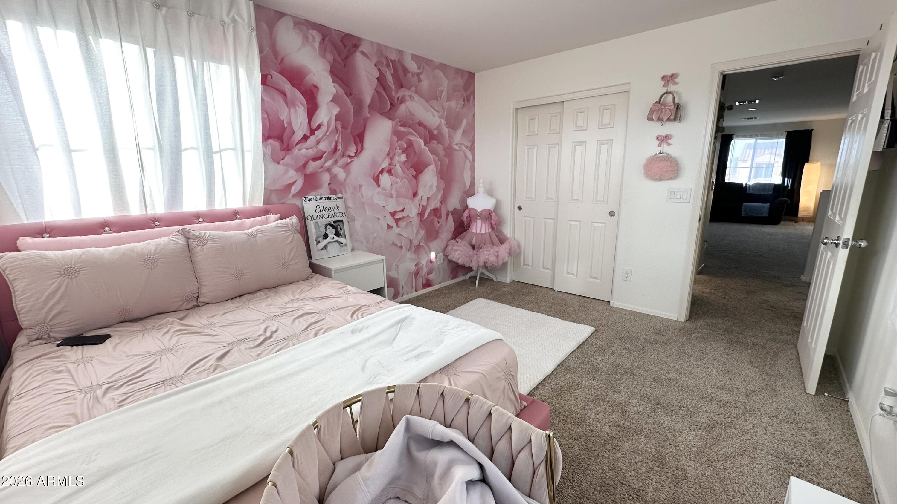 12202 West Del Rio Lane Avondale, AZ 85323 - Photo 49 of 60 a bedroom with a bed and a couch