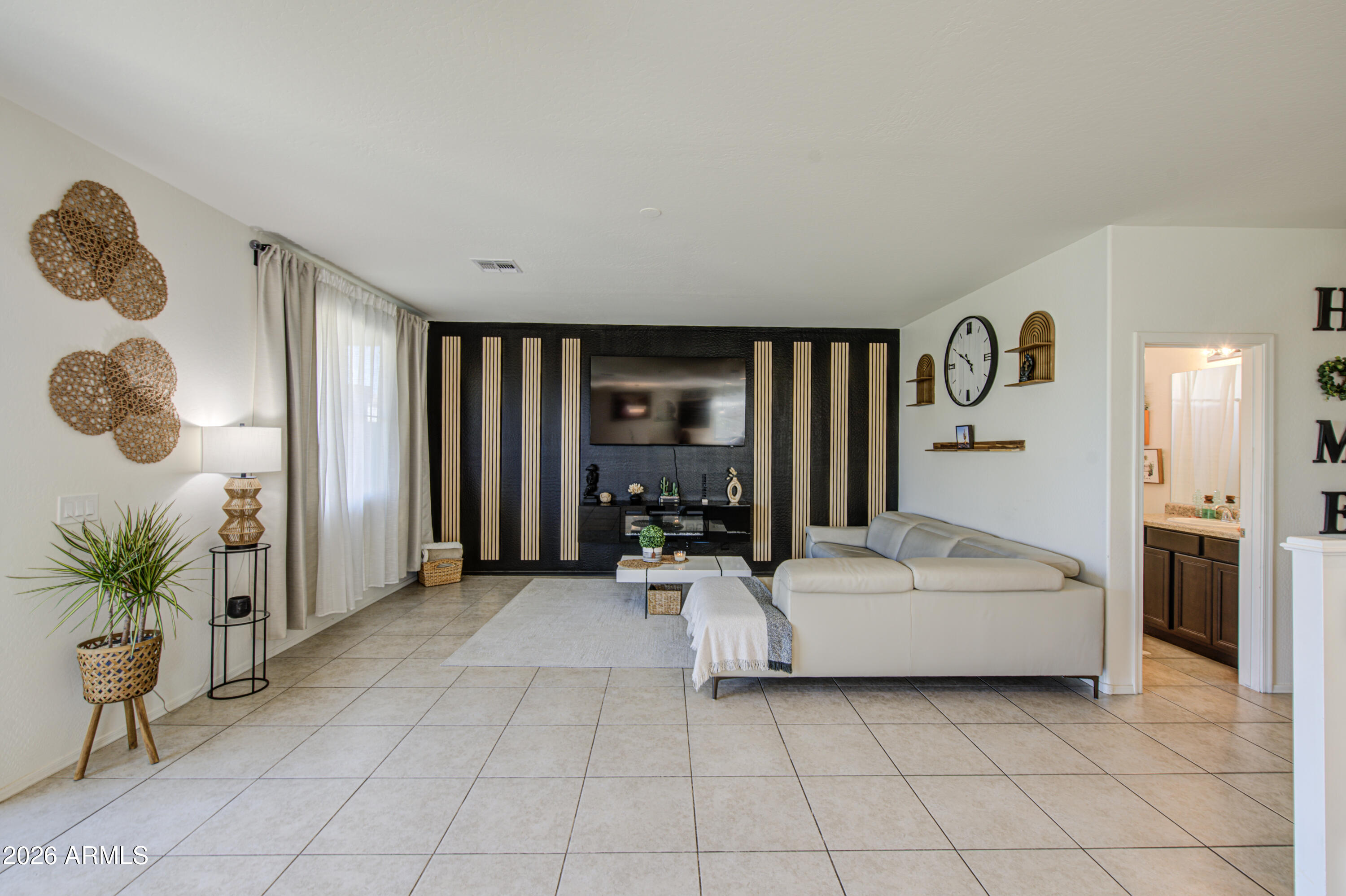 12202 West Del Rio Lane Avondale, AZ 85323 - Photo 6 of 49 a large white room with a large mirror and furniture