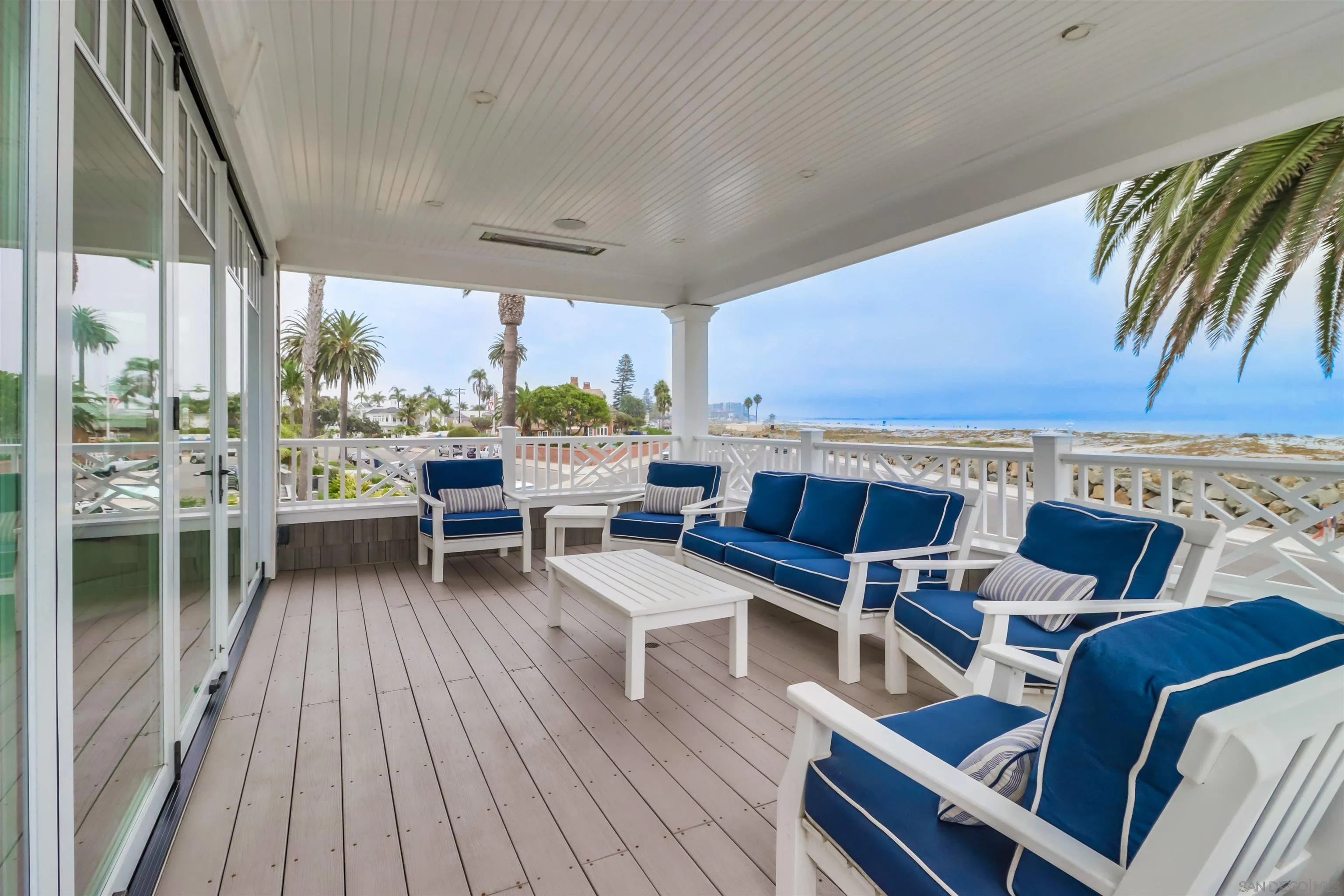 441 Ocean Boulevard Coronado, CA 92118 - Photo 11 of 40 a roof deck with a table and chairs