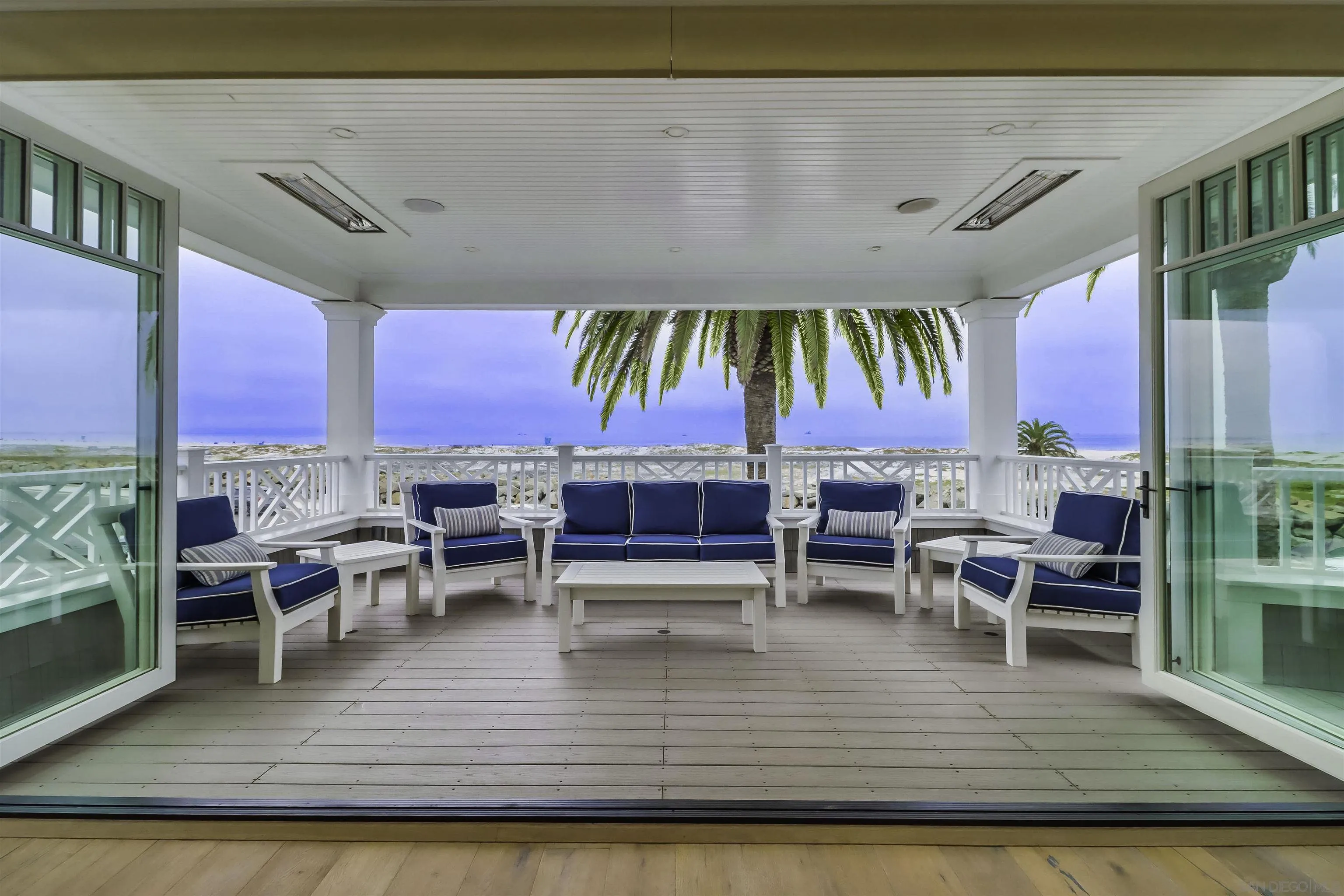 441 Ocean Boulevard Coronado, CA 92118 - Photo 12 of 40 a view of a dining room with furniture and chandelier