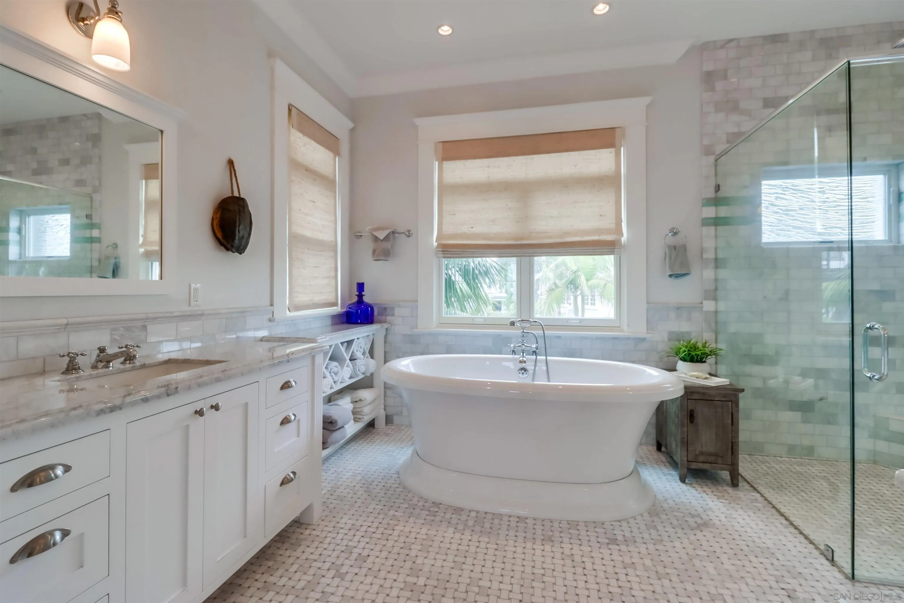 441 Ocean Boulevard Coronado, CA 92118 - Photo 17 of 40 a spacious bathroom with a bathtub shower sink and mirror