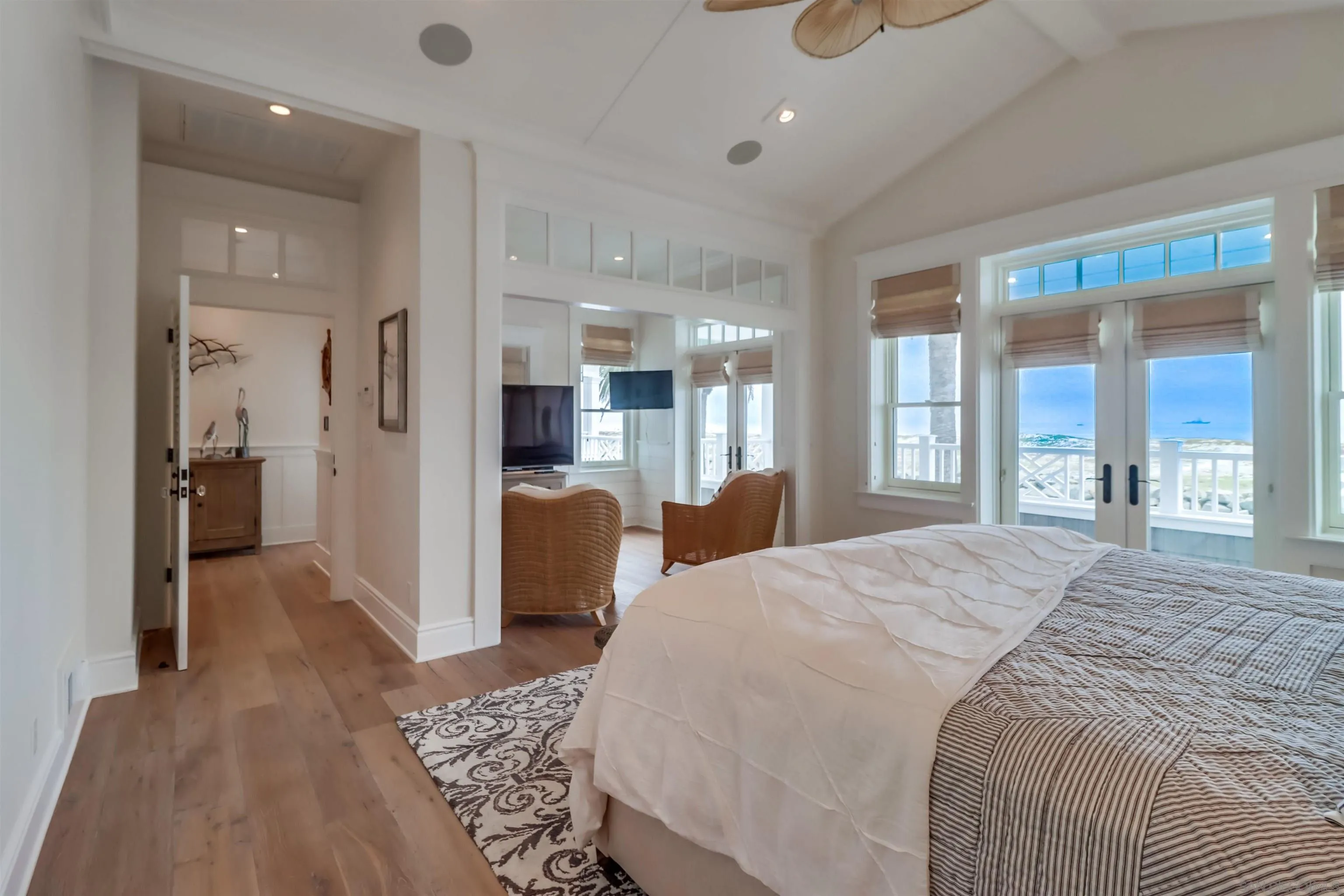 441 Ocean Boulevard Coronado, CA 92118 - Photo 20 of 40 a large bedroom with a bed and glass door