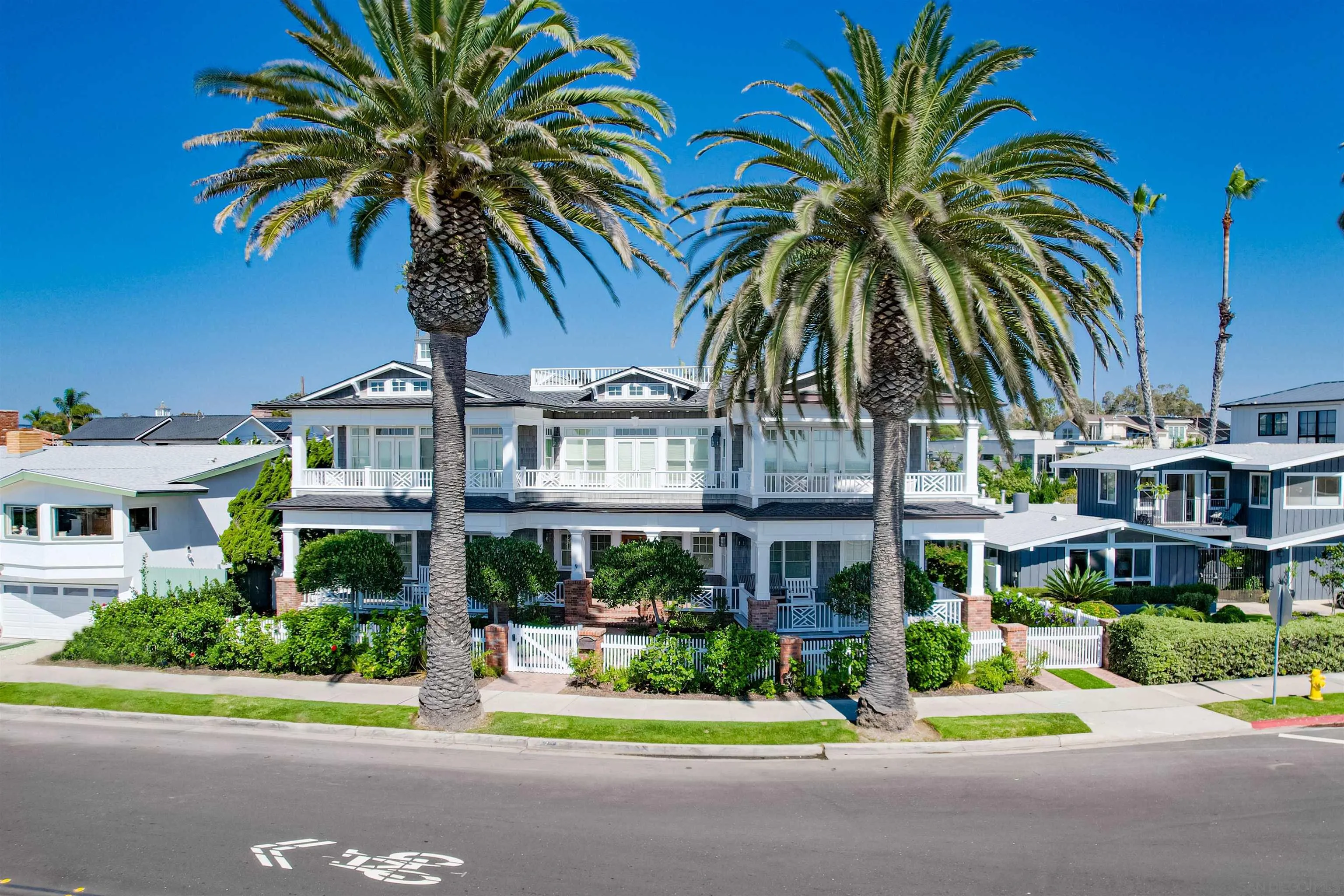 441 Ocean Boulevard Coronado, CA 92118 - Photo 2 of 40 a front view of multi story residential apartment building with yard and green space