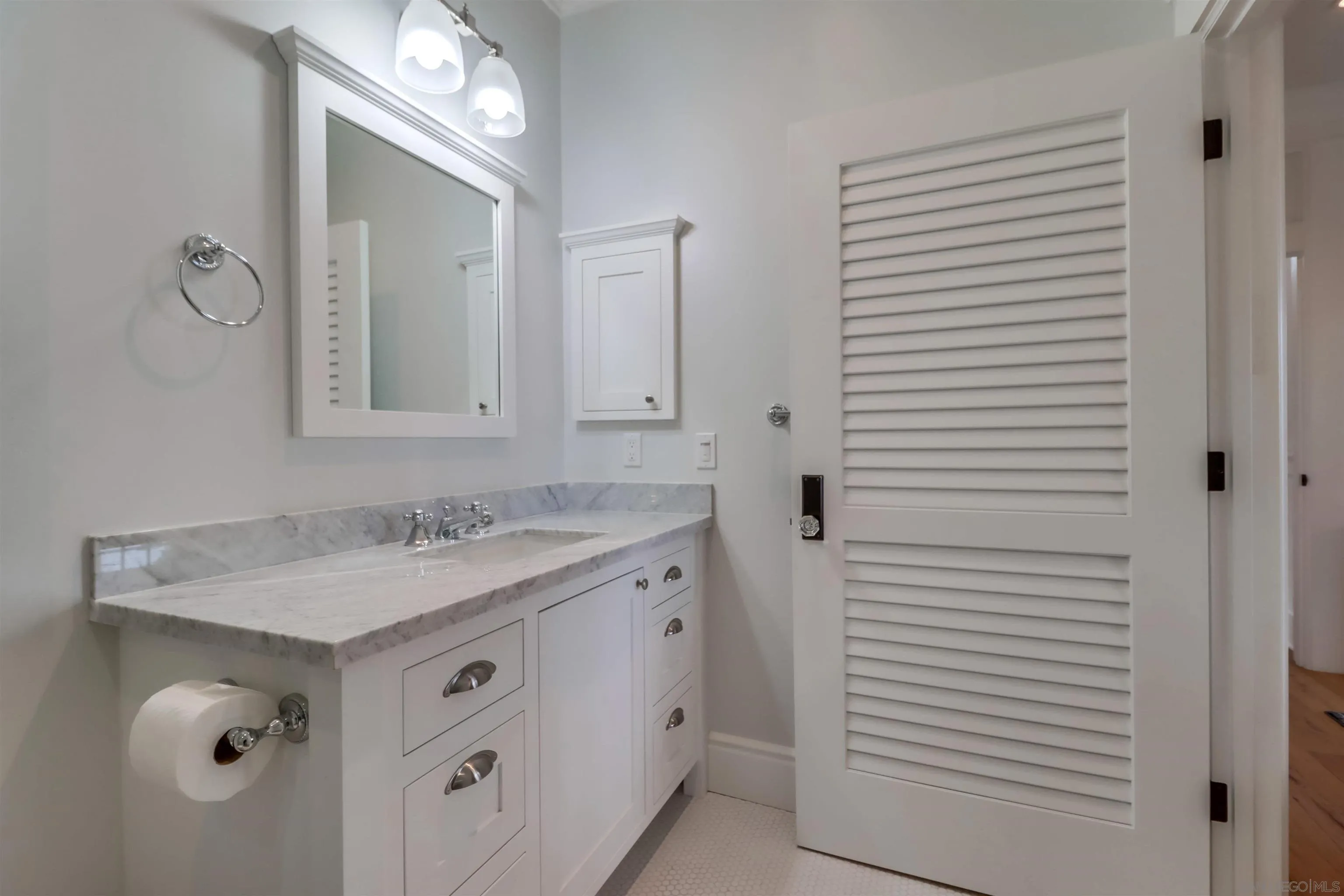 441 Ocean Boulevard Coronado, CA 92118 - Photo 24 of 40 a bathroom with a granite countertop sink and a mirror