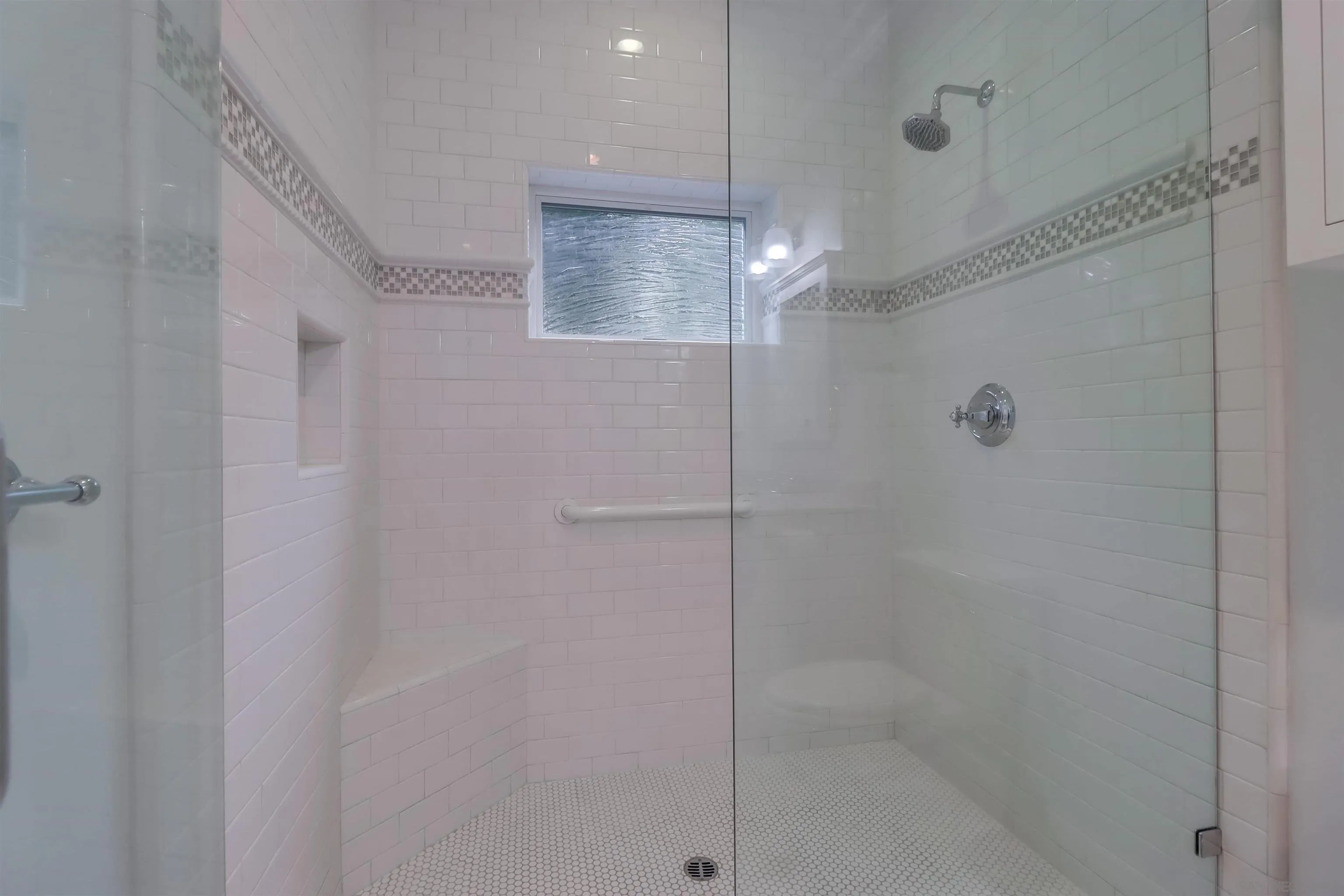 441 Ocean Boulevard Coronado, CA 92118 - Photo 25 of 40 a bathroom with a glass shower door