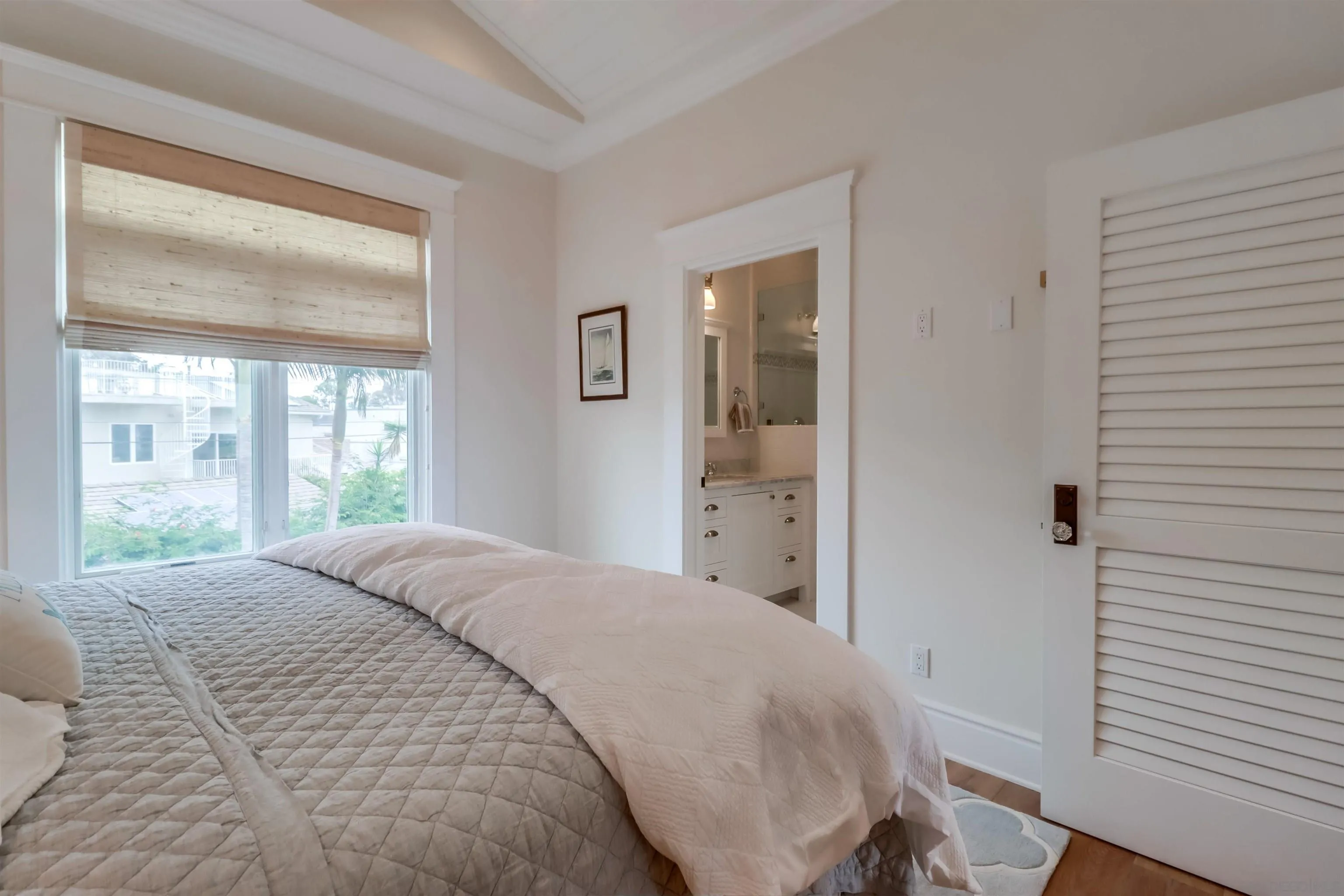 441 Ocean Boulevard Coronado, CA 92118 - Photo 28 of 40 a bedroom with a bed and a window