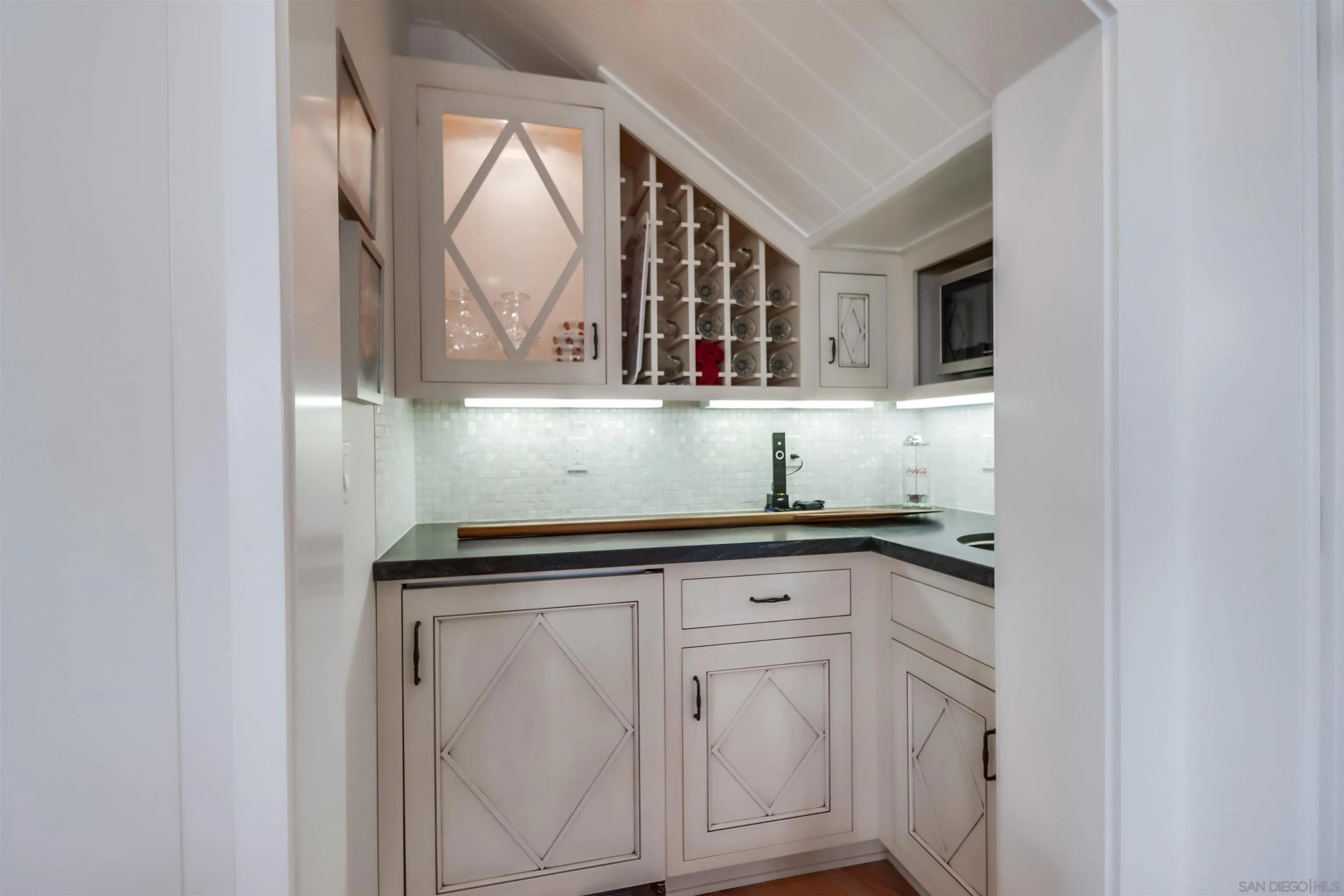 441 Ocean Boulevard Coronado, CA 92118 - Photo 32 of 40 a view of cabinets a sink and a window