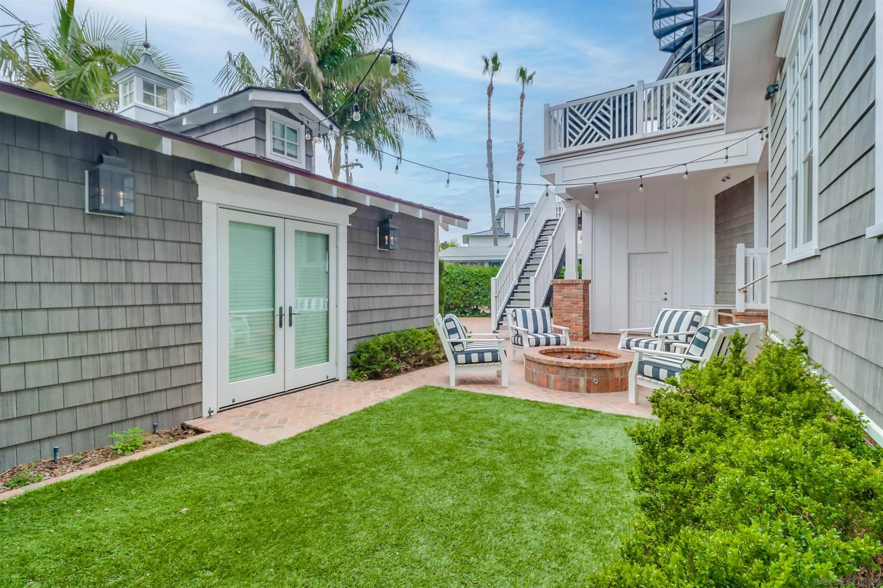 441 Ocean Boulevard Coronado, CA 92118 - Photo 33 of 40 a view of a house with backyard sitting area and garden