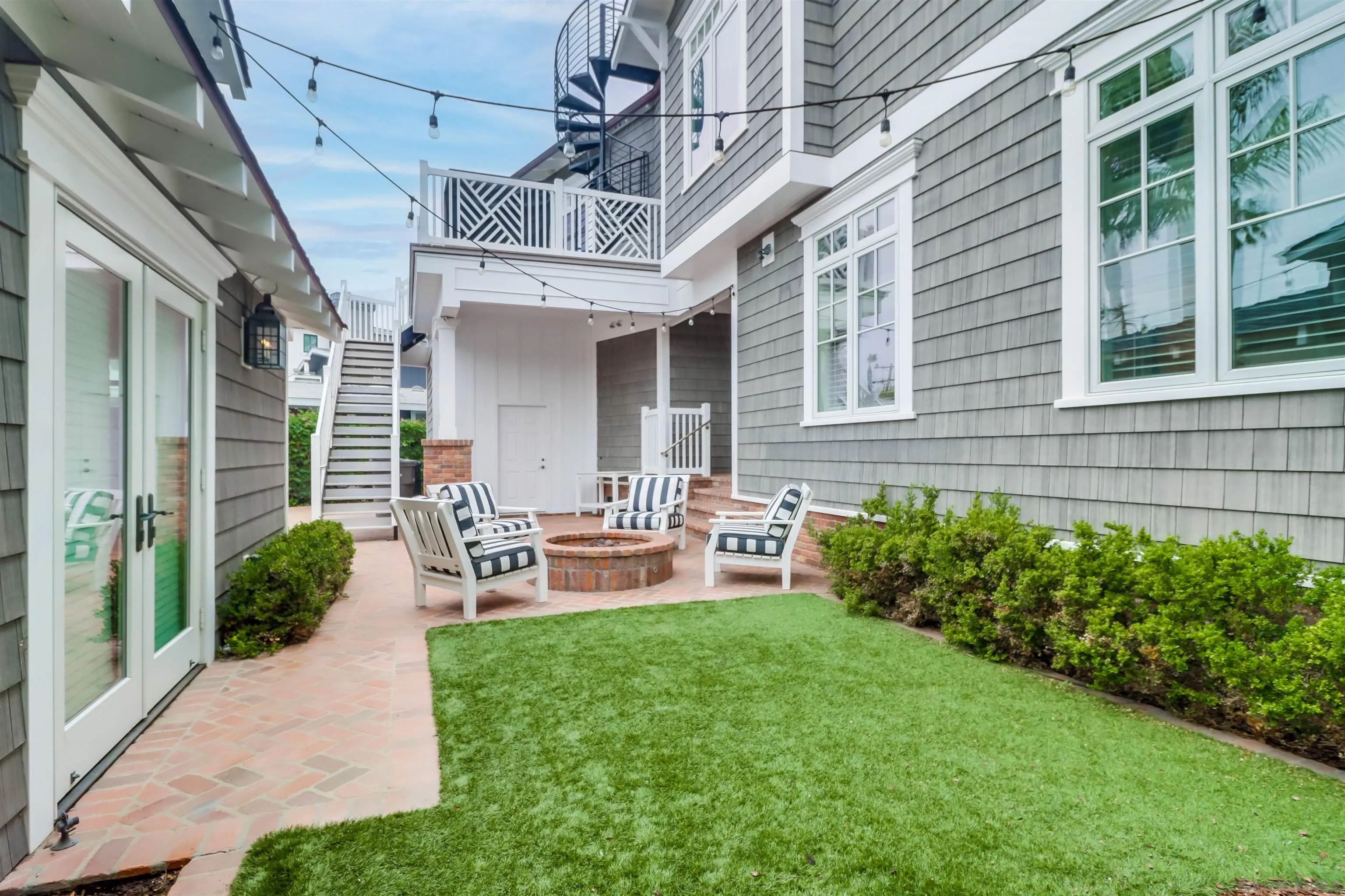 441 Ocean Boulevard Coronado, CA 92118 - Photo 37 of 40 a front view of a house with patio and garden