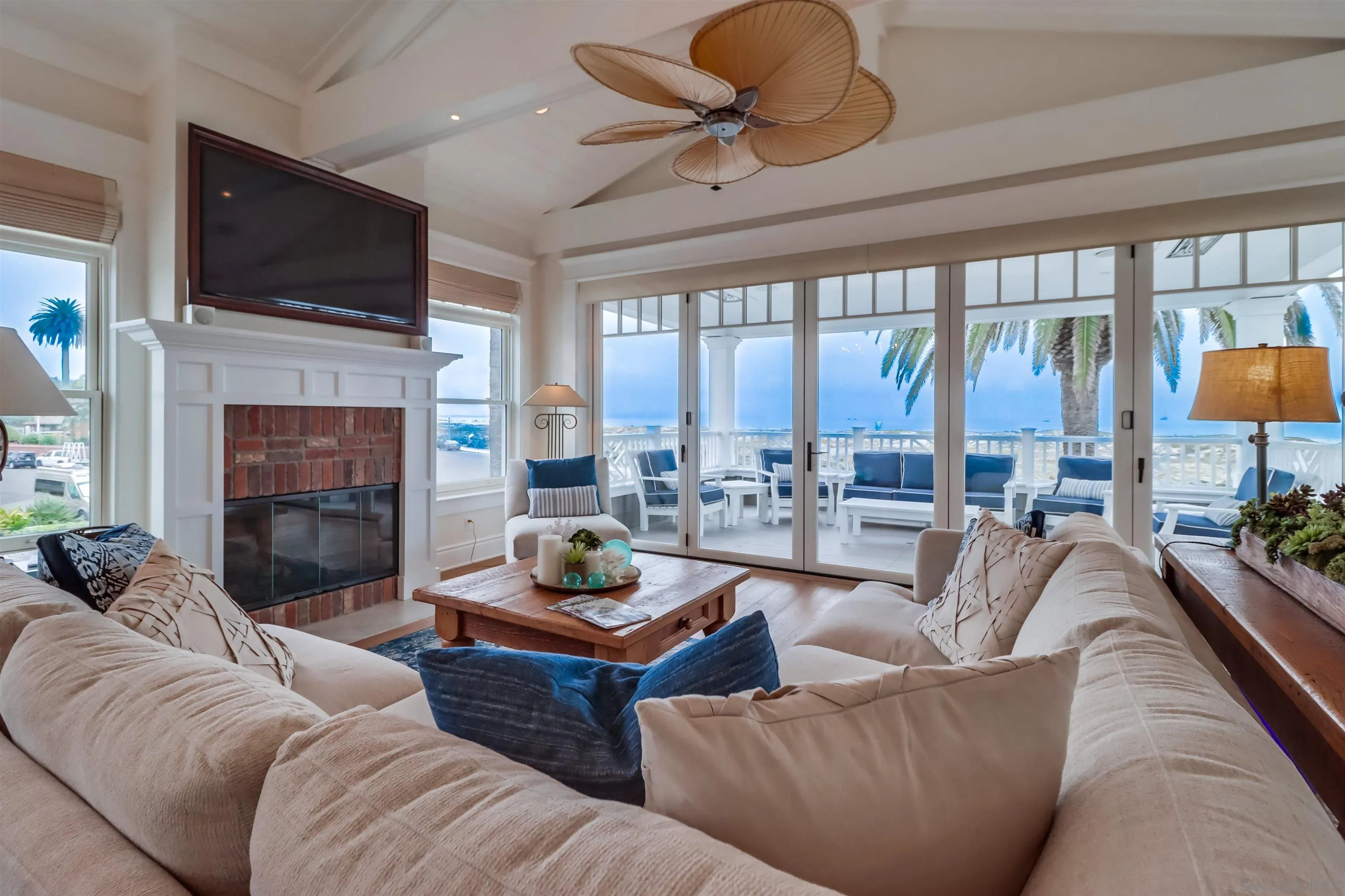 441 Ocean Boulevard Coronado, CA 92118 - Photo 5 of 40 a living room with fireplace furniture and a flat screen tv