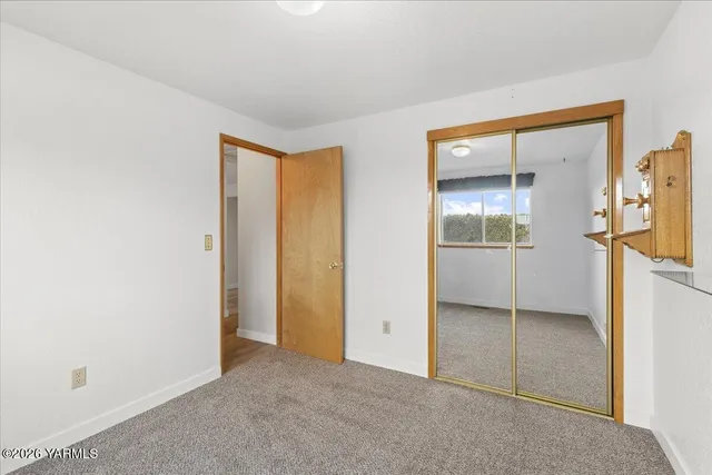 an empty room with a bathroom