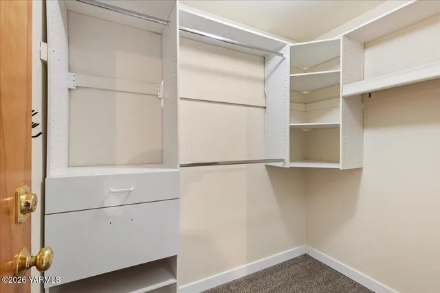 a view of an empty walk in closet