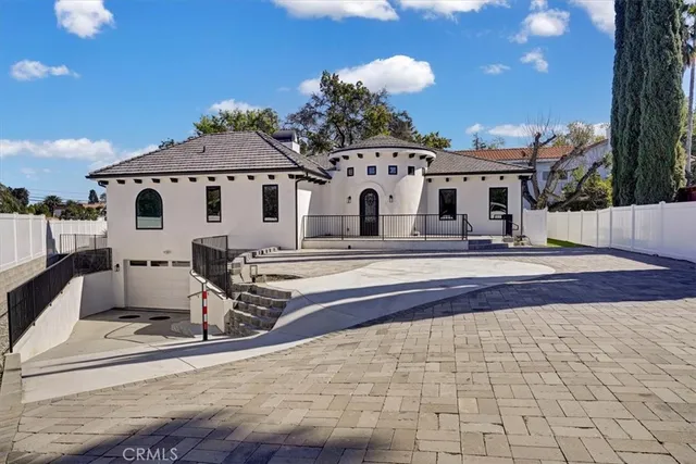 a view of a house with a sink and yard