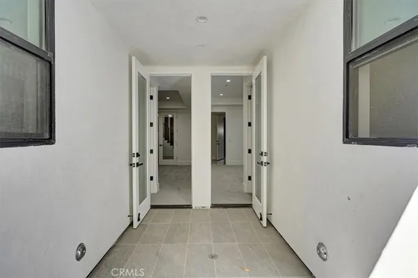 wooden floor and a bathroom with a sink