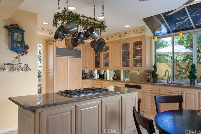 a kitchen with a stove a sink and a refrigerator