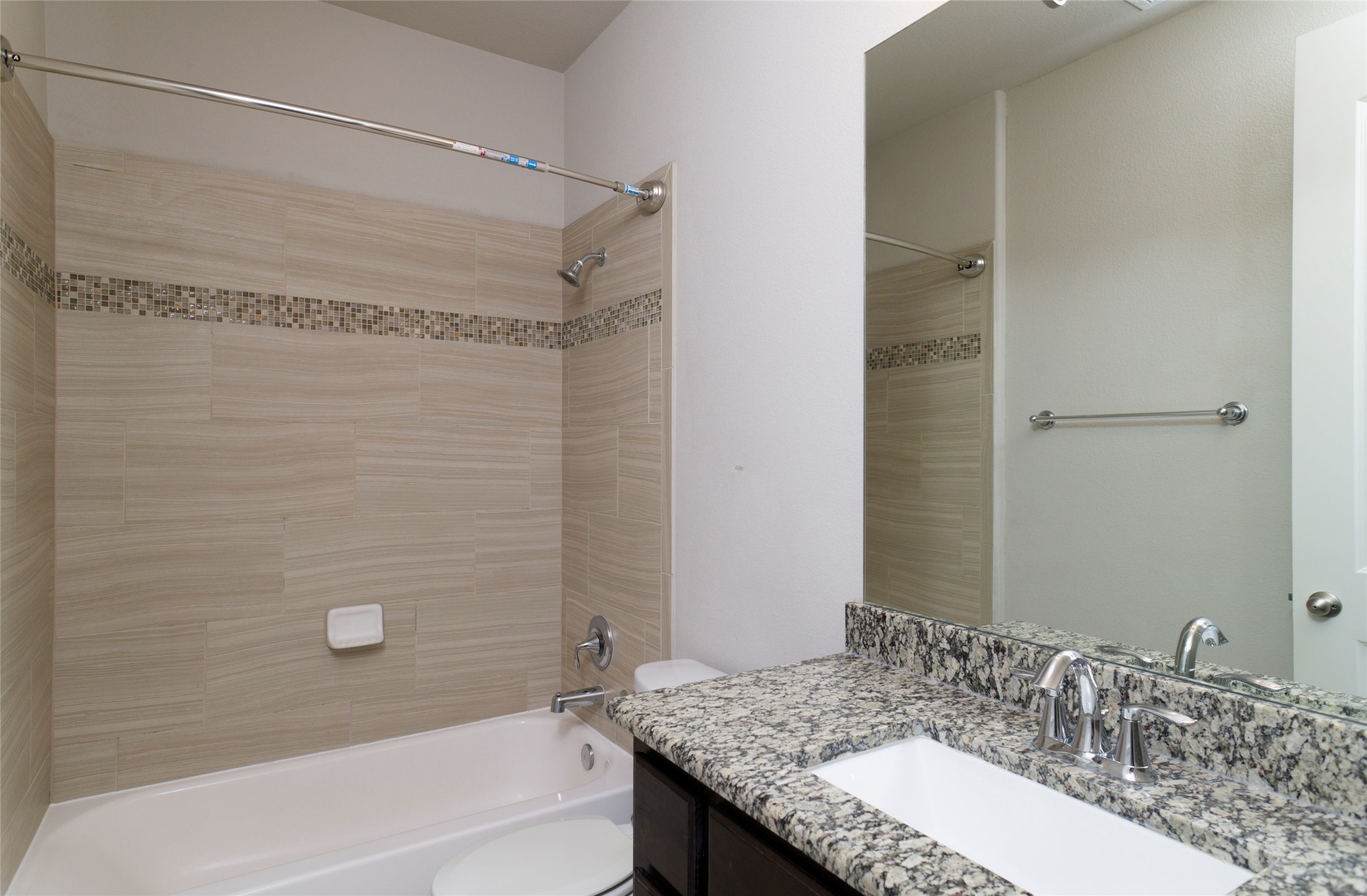 4001 Goodnight Trail Leander, TX 78641 - Photo 22 of 35 a bathroom with a granite countertop sink and a mirror