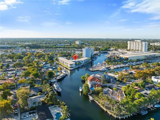 an aerial view of a house with a ocean view