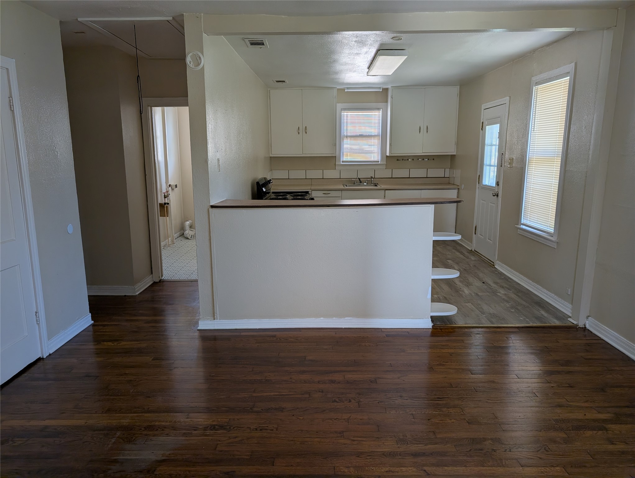 724 West 8th Street Taylor, TX 76574 - Photo 4 of 7 a view of a kitchen cabinets and wooden floor