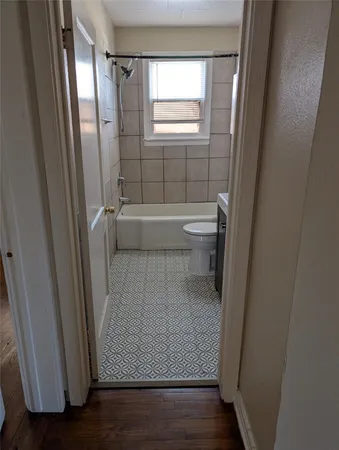 a view of bathroom with bathtub and shower