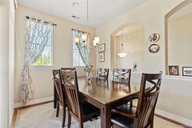 a view of a dining room with furniture and window