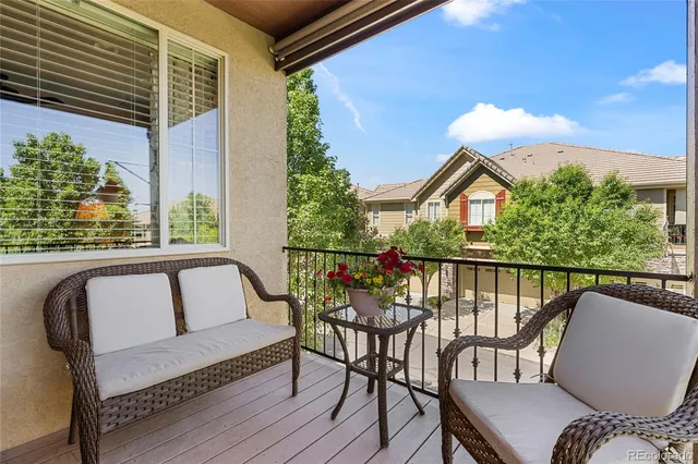 a view of a chairs and table on the deck