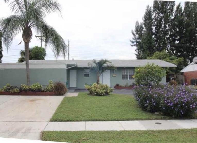 2424 Ware Drive West Palm Beach, FL 33409 - Photo 1 of 9 Triplex 2/1-2/1-1/1